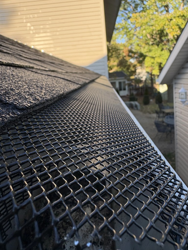 After gutter cleaning and gutter guard installation in St. Charles County, Missouri, showing protected residential gutters installed by Cut For The Cure Lawncare.