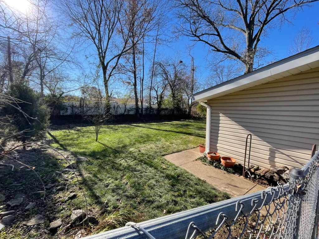 After leaf removal service in St. Charles County, Missouri, showing a clean residential yard following professional cleanup by Cut For The Cure Lawncare.