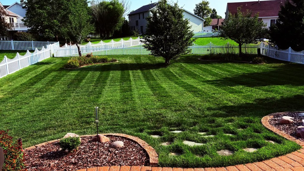 Back yard lawn professionally mowed in a St. Charles County neighborhood